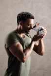 Strong man has a bunny on his hand
