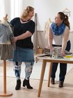 Two women at a tailor