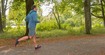 A man jogging in the woods