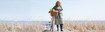 Woman on a walkway close to the beach.