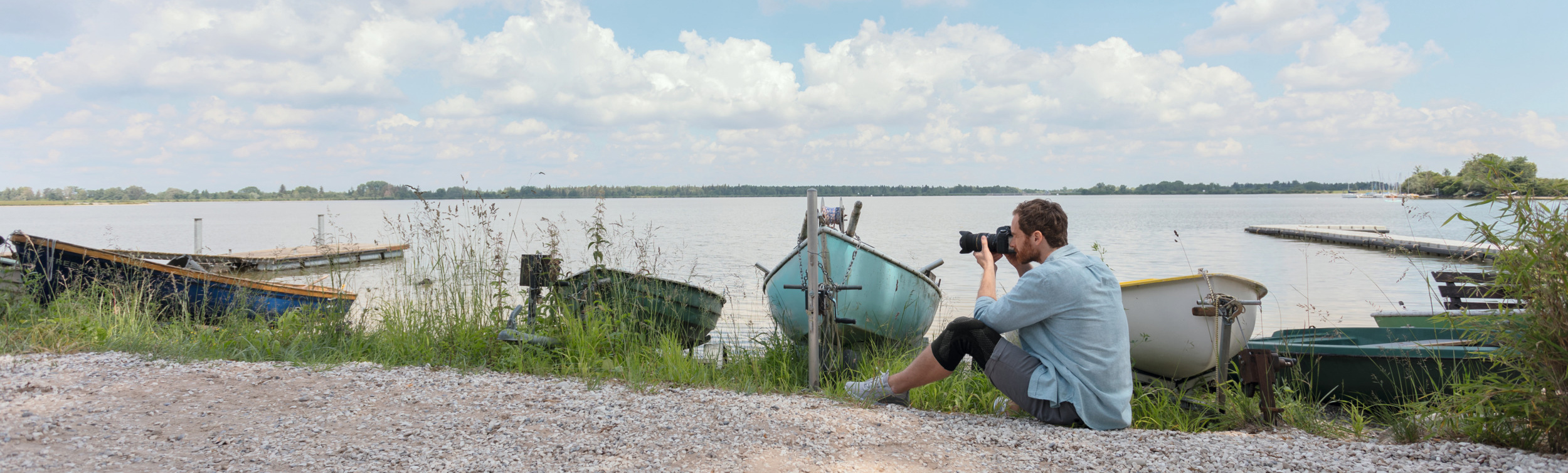 Fotograf nad jeziorem z JuzoFlex Genu Xtra Fotograf nad jeziorem z JuzoFlex Genu Xtra